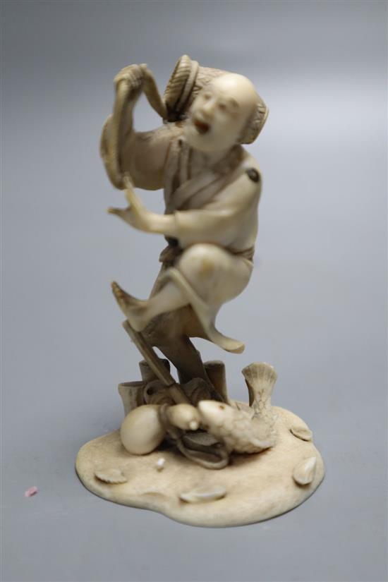 A fine 19th century Japanese ivory okimono of a fisherman startled by a fish, meiji period, height 8cm